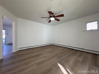29 Arizona Avenue Syosset, NY 11791 - Photo 18 of 26 a view of an empty room with wooden floor