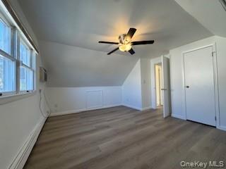 29 Arizona Avenue Syosset, NY 11791 - Photo 23 of 26 wooden floor in an empty room with a window