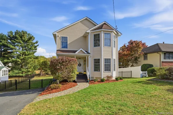 a front view of a house with a yard