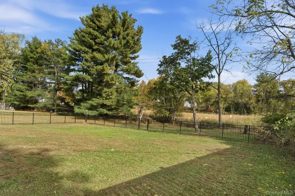 a view of outdoor space with deck and trees