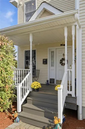 a view of a house with wooden stairs