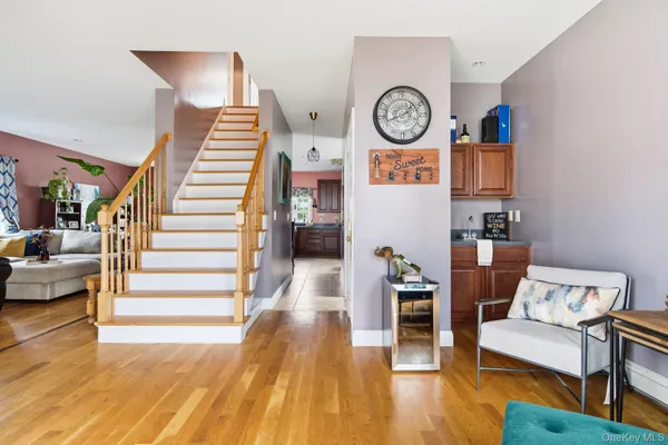 a living room with furniture and a clock