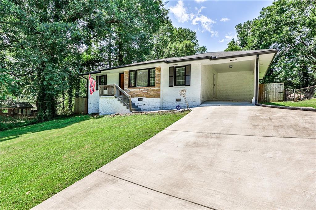 2143 Windell Drive Decatur, GA 30032 - Photo 1 of 1 a front view of house with yard and green space