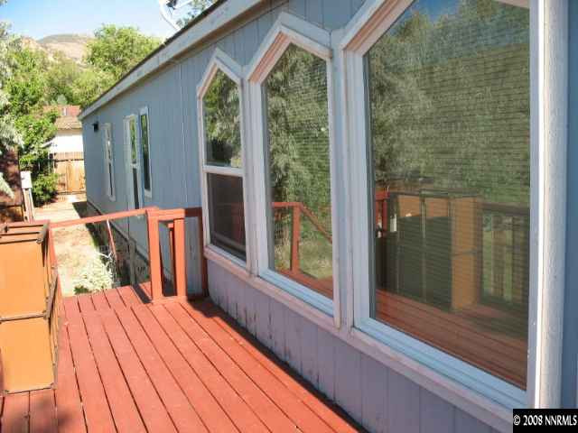 1525 Moon Lane Reno, NV 89521 - Photo 6 of 6 a balcony with wooden floor table and chairs