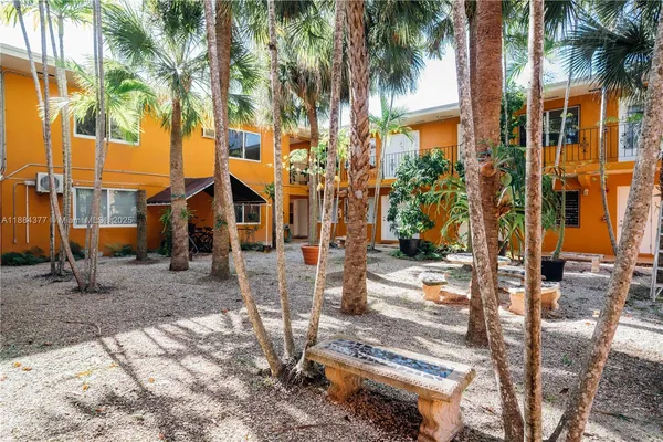 a view of a palm trees in front of a house