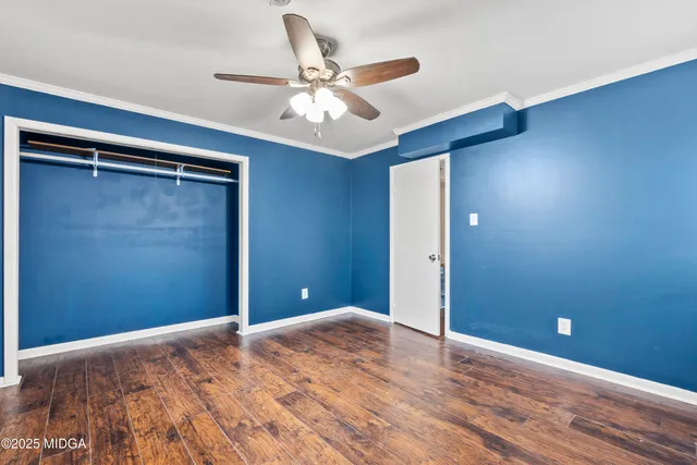 a view of a room with a ceiling fan