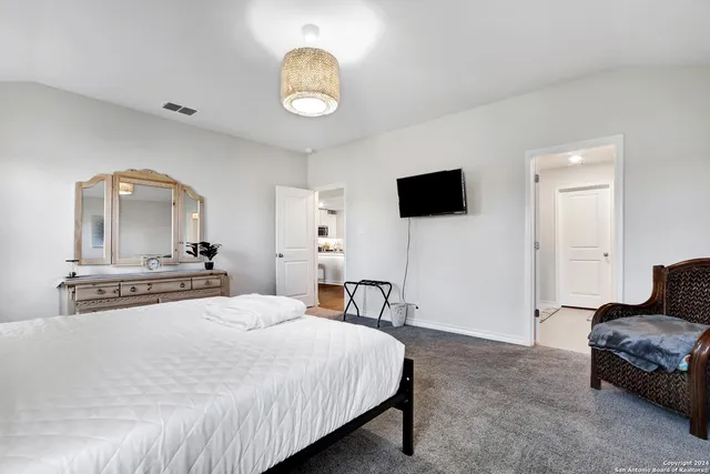 a bathroom with double sink and a mirror