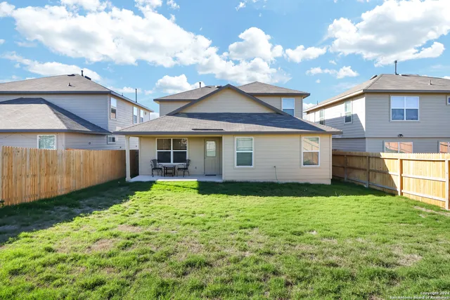 a view of swimming pool and lounge chairs