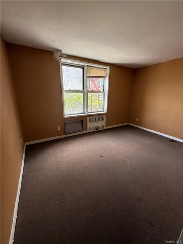 a view of a livingroom with furniture and windows