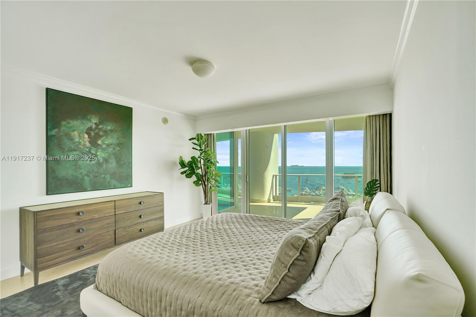 2627 South Bayshore Drive, Unit 1806 Miami, FL 33133 - Photo 12 of 33 a bedroom with a bed and a window