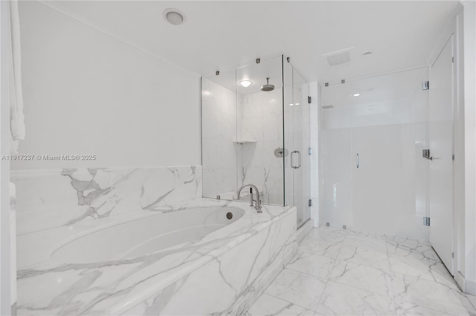 2627 South Bayshore Drive, Unit 1806 Miami, FL 33133 - Photo 15 of 33 a spacious bathroom with a bathtub and shower