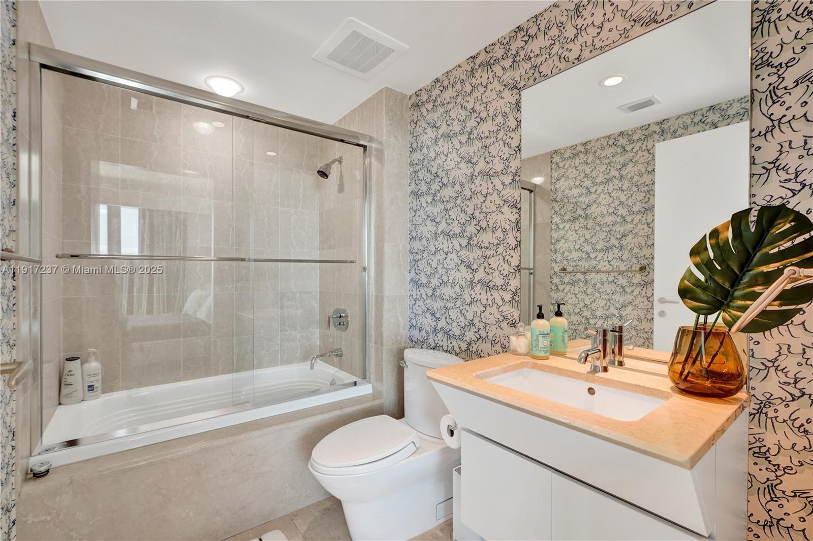 2627 South Bayshore Drive, Unit 1806 Miami, FL 33133 - Photo 25 of 33 a bathroom with a sink toilet and shower