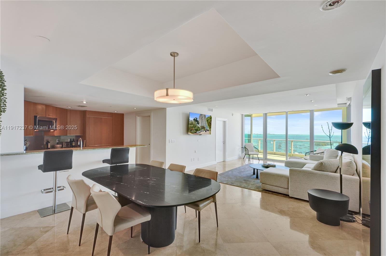2627 South Bayshore Drive, Unit 1806 Miami, FL 33133 - Photo 3 of 33 a view of a dining room with furniture window and outside view