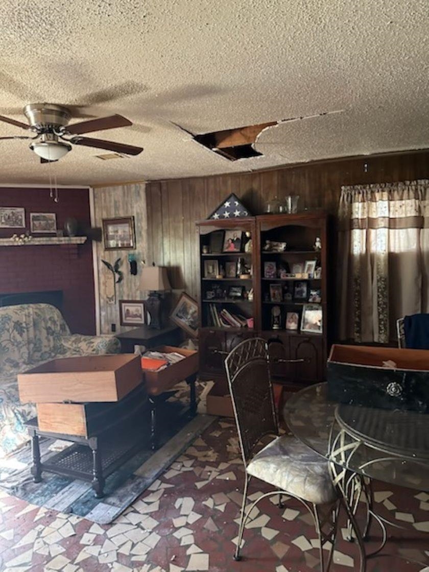 400 Hazelwood Road Memphis, TN 38109 - Photo 10 of 15 Dining area featuring ceiling fan and wooden walls