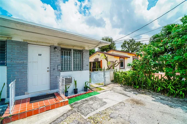 a house view with a backyard space
