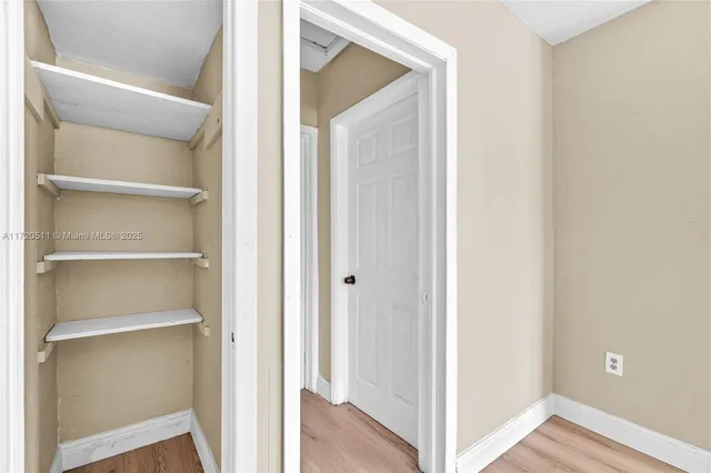 a view of a hallway with closet