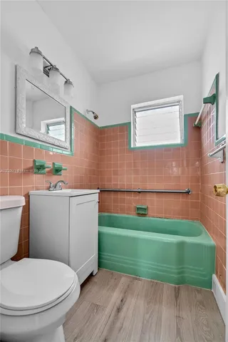 a bathroom with a toilet and a sink