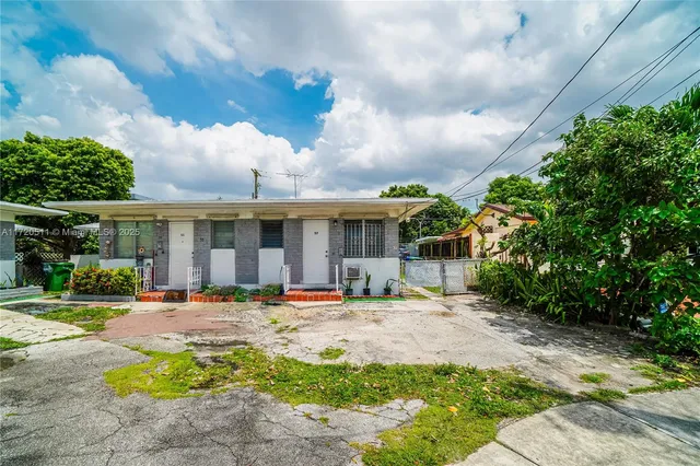 a front view of a building with an outdoor seating