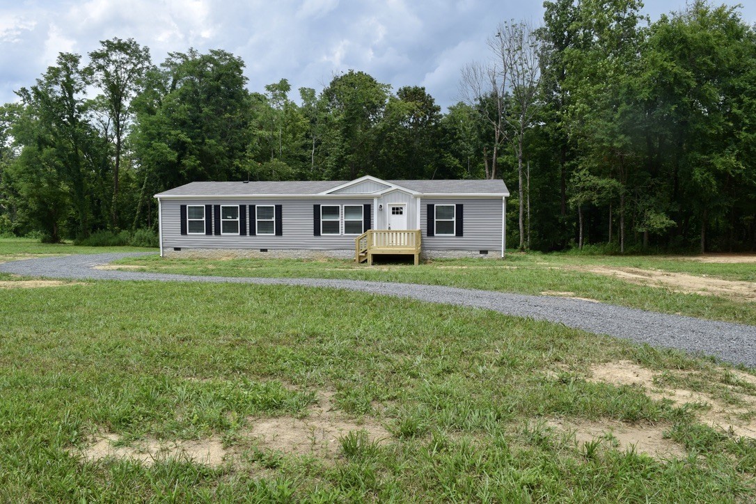 2166 Shrum Cemetery Road Westmoreland, TN 37186 - Photo 1 of 32 a house view with a garden space