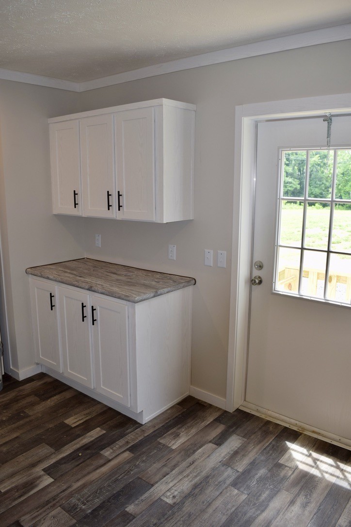 2166 Shrum Cemetery Road Westmoreland, TN 37186 - Photo 14 of 32 a view of a kitchen with wooden floor and a window