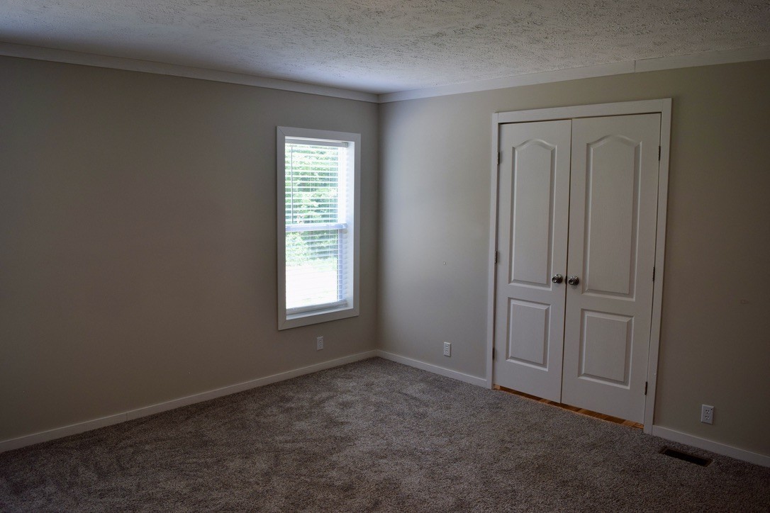 2166 Shrum Cemetery Road Westmoreland, TN 37186 - Photo 16 of 32 an empty room with windows