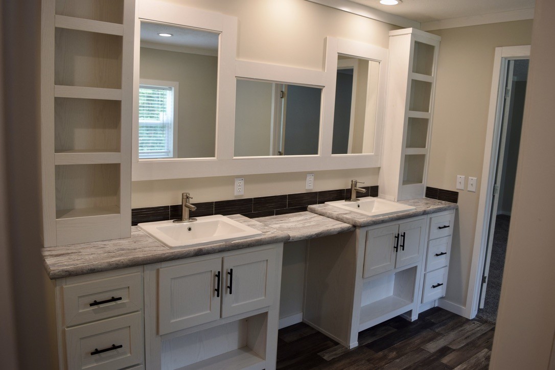 2166 Shrum Cemetery Road Westmoreland, TN 37186 - Photo 22 of 32 a bathroom with a sink and a mirror