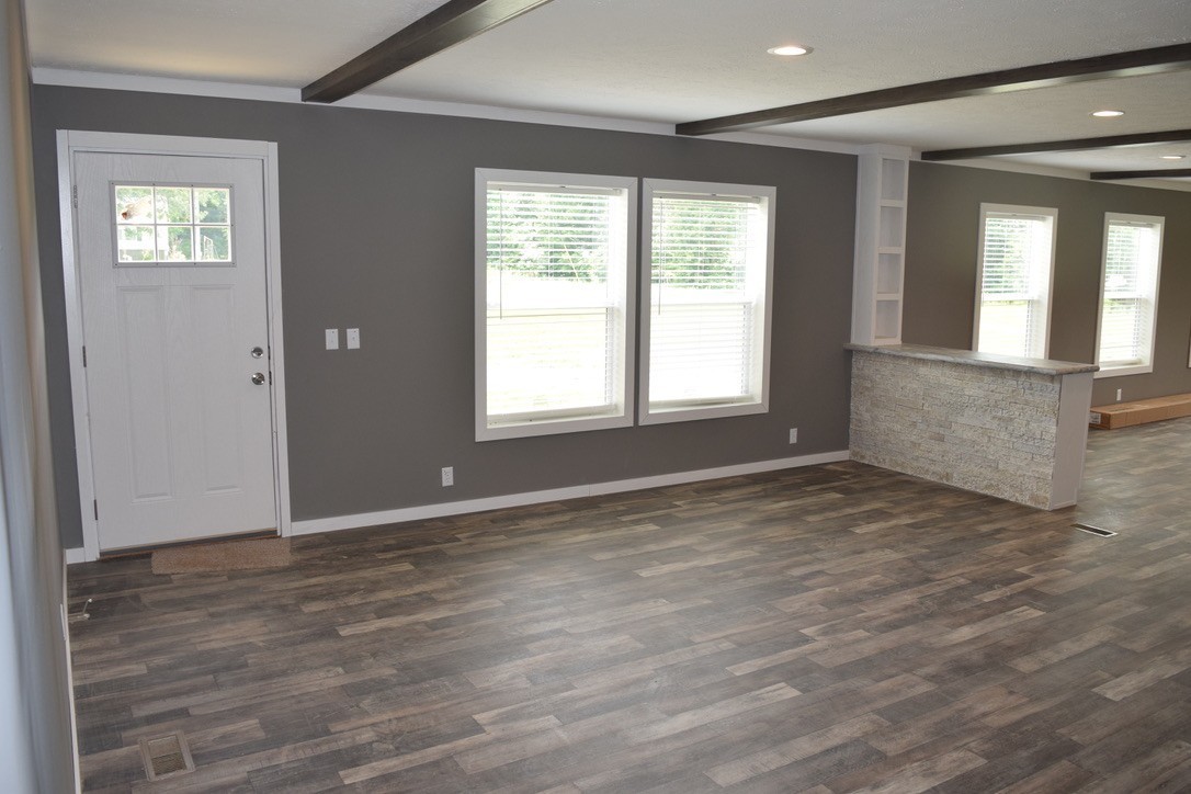2166 Shrum Cemetery Road Westmoreland, TN 37186 - Photo 5 of 32 an empty room with wooden floor and windows