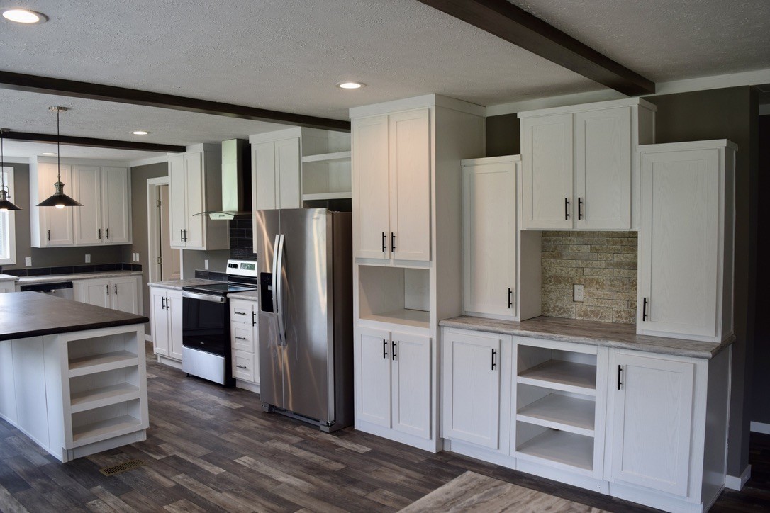 2166 Shrum Cemetery Road Westmoreland, TN 37186 - Photo 8 of 32 a kitchen with a refrigerator and a stove top oven