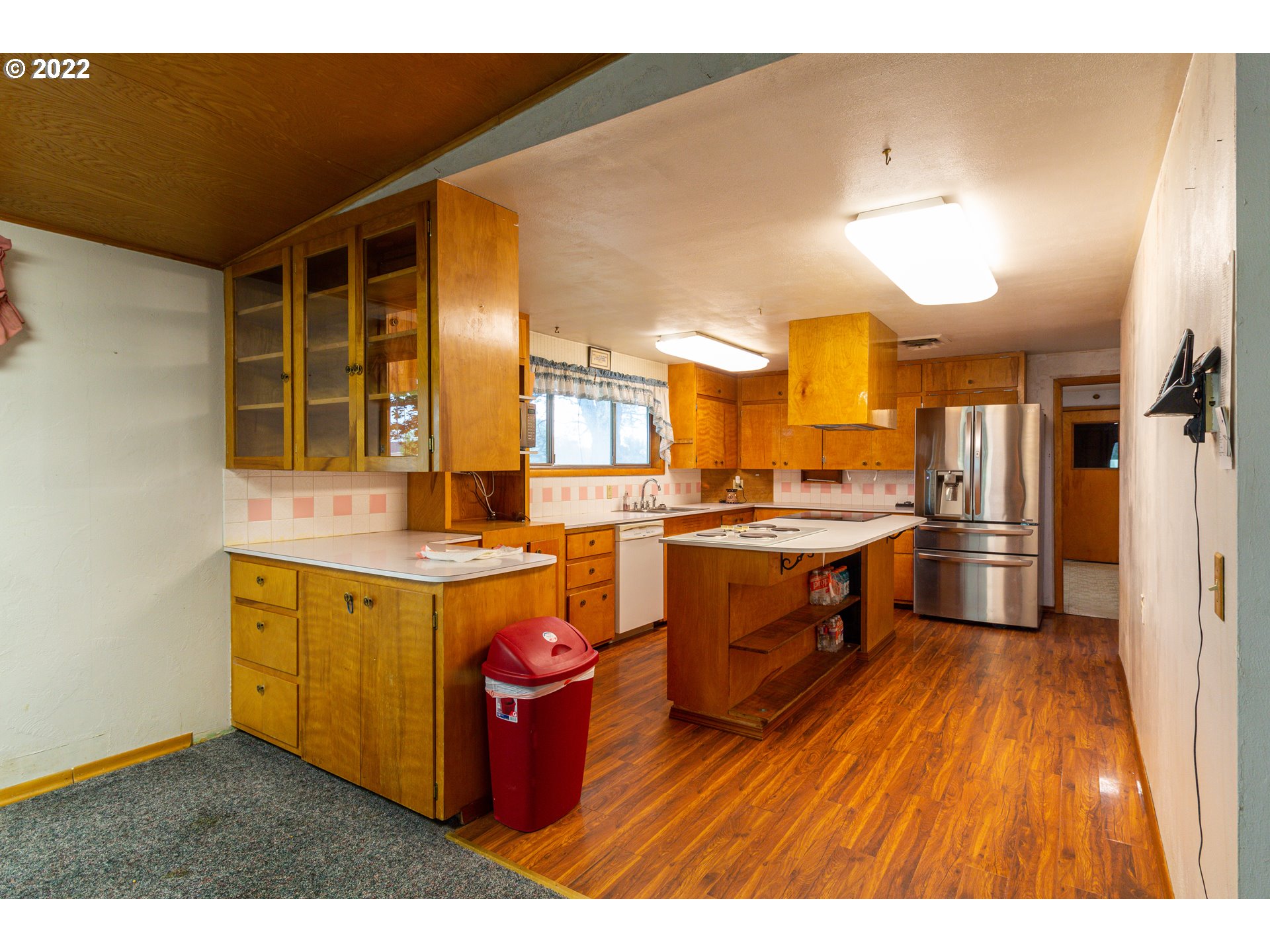 33225 West Spearman Road Hermiston, OR 97838 - Photo 11 of 32 a kitchen with a sink cabinets and wooden floor