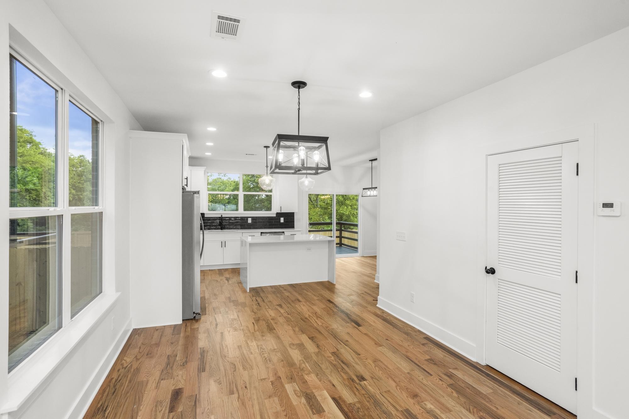 656 Chambers Street, Unit 140 Gallatin, TN 37066 - Photo 11 of 40 a view of a kitchen with wooden floor and outdoor space