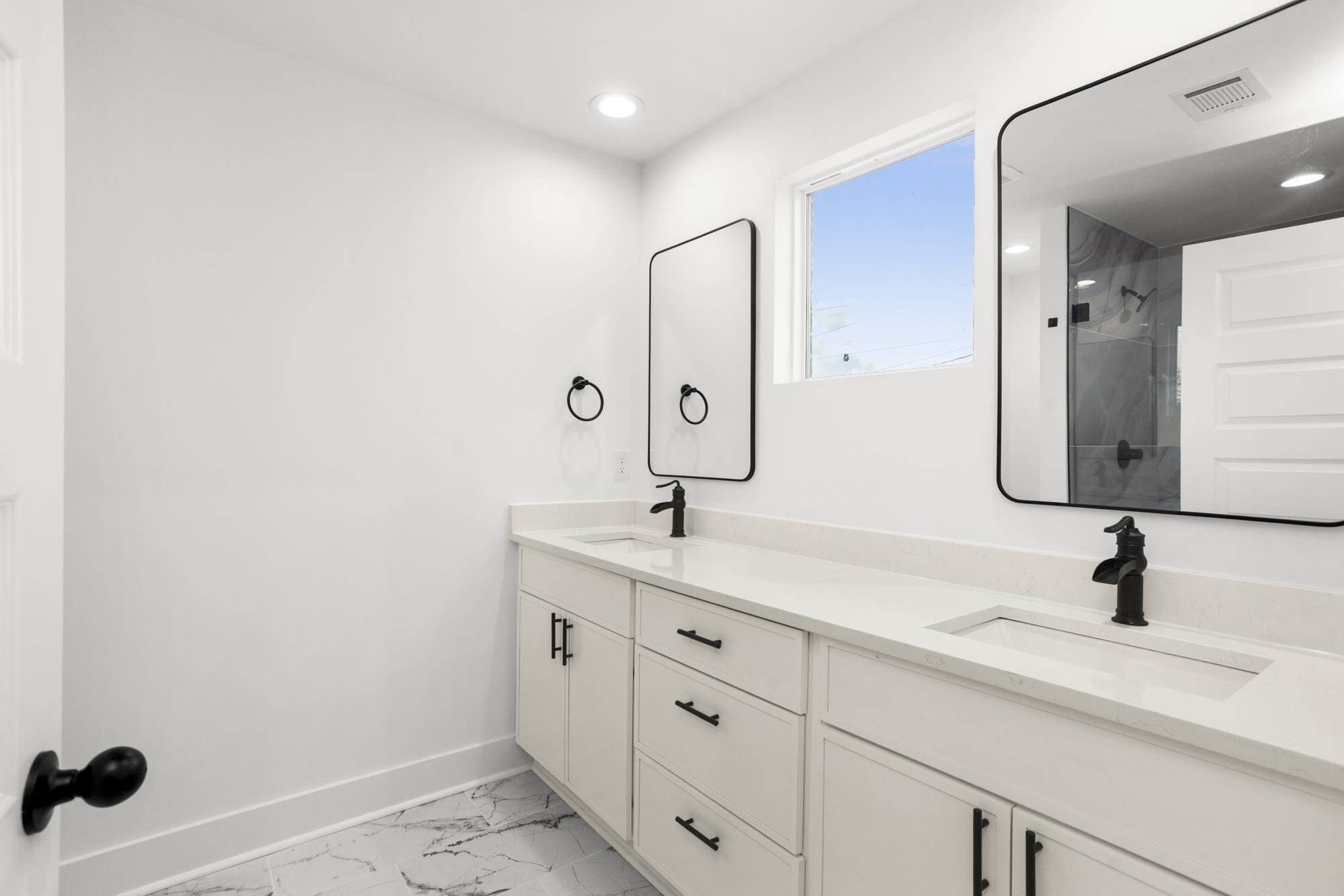 656 Chambers Street, Unit 140 Gallatin, TN 37066 - Photo 12 of 40 a bathroom with a double vanity sink and mirror