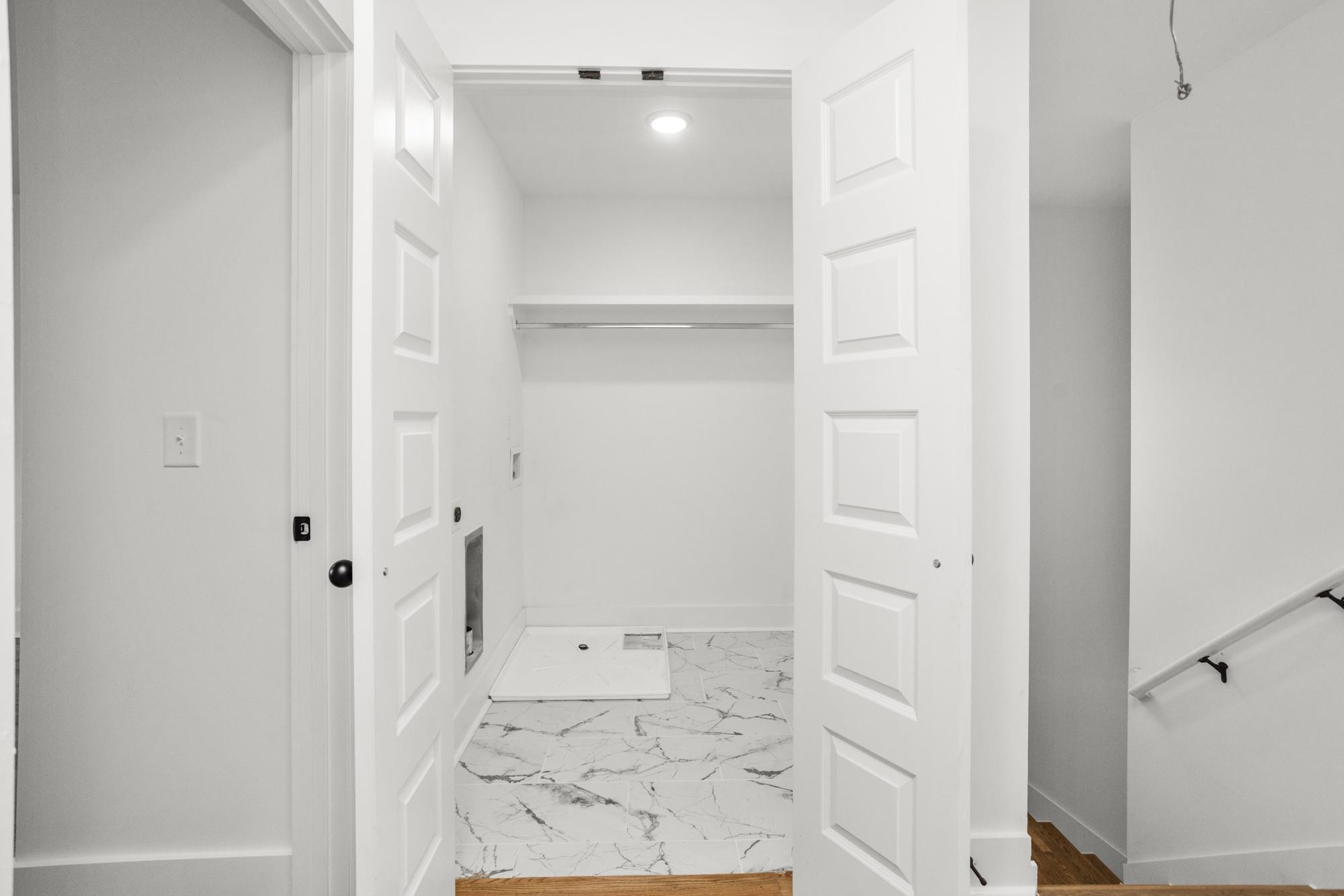 656 Chambers Street, Unit 140 Gallatin, TN 37066 - Photo 18 of 40 a view of a hallway with wooden floor and a bathroom