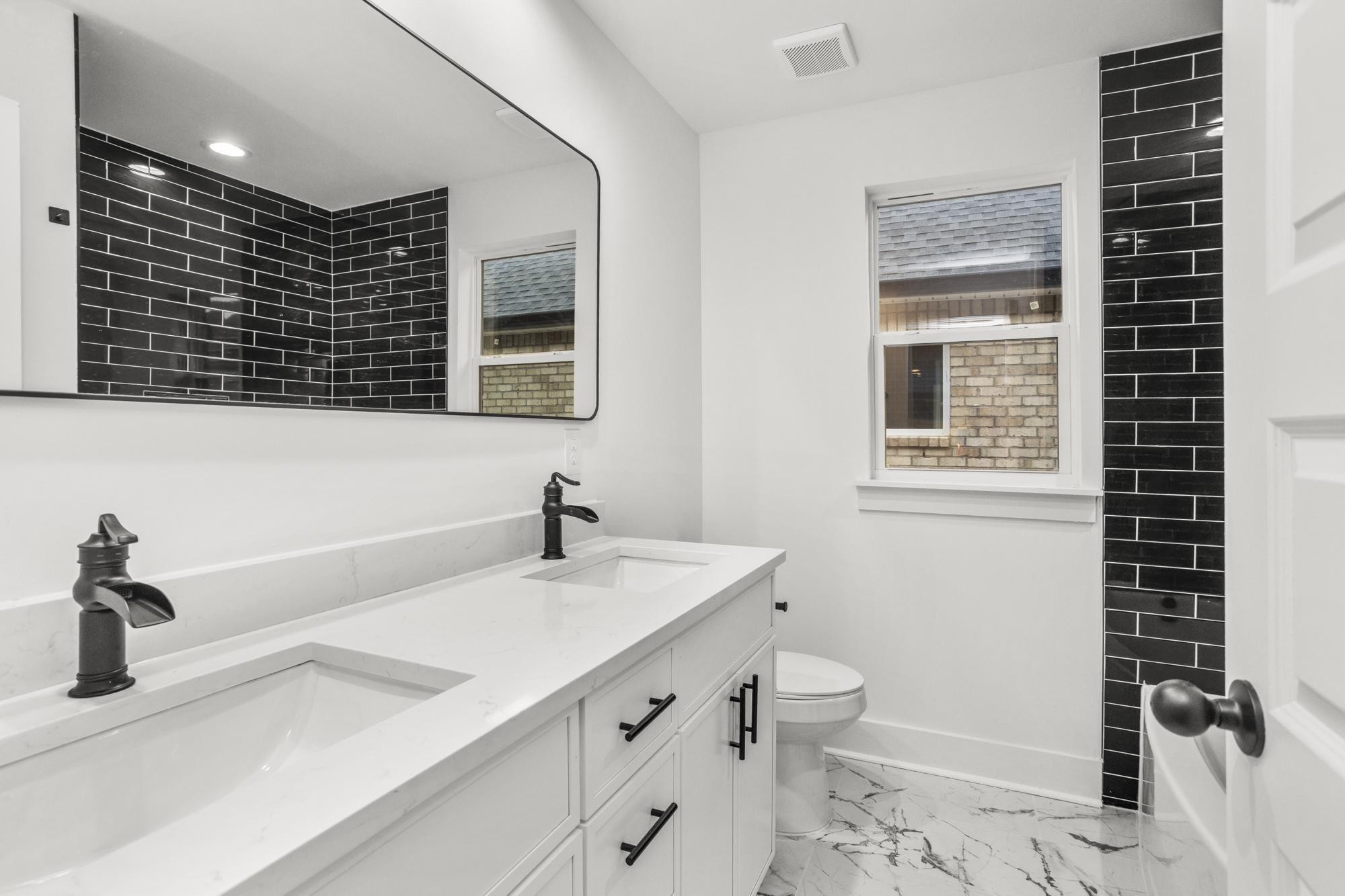 656 Chambers Street, Unit 140 Gallatin, TN 37066 - Photo 20 of 40 a bathroom with a sink a toilet and shower