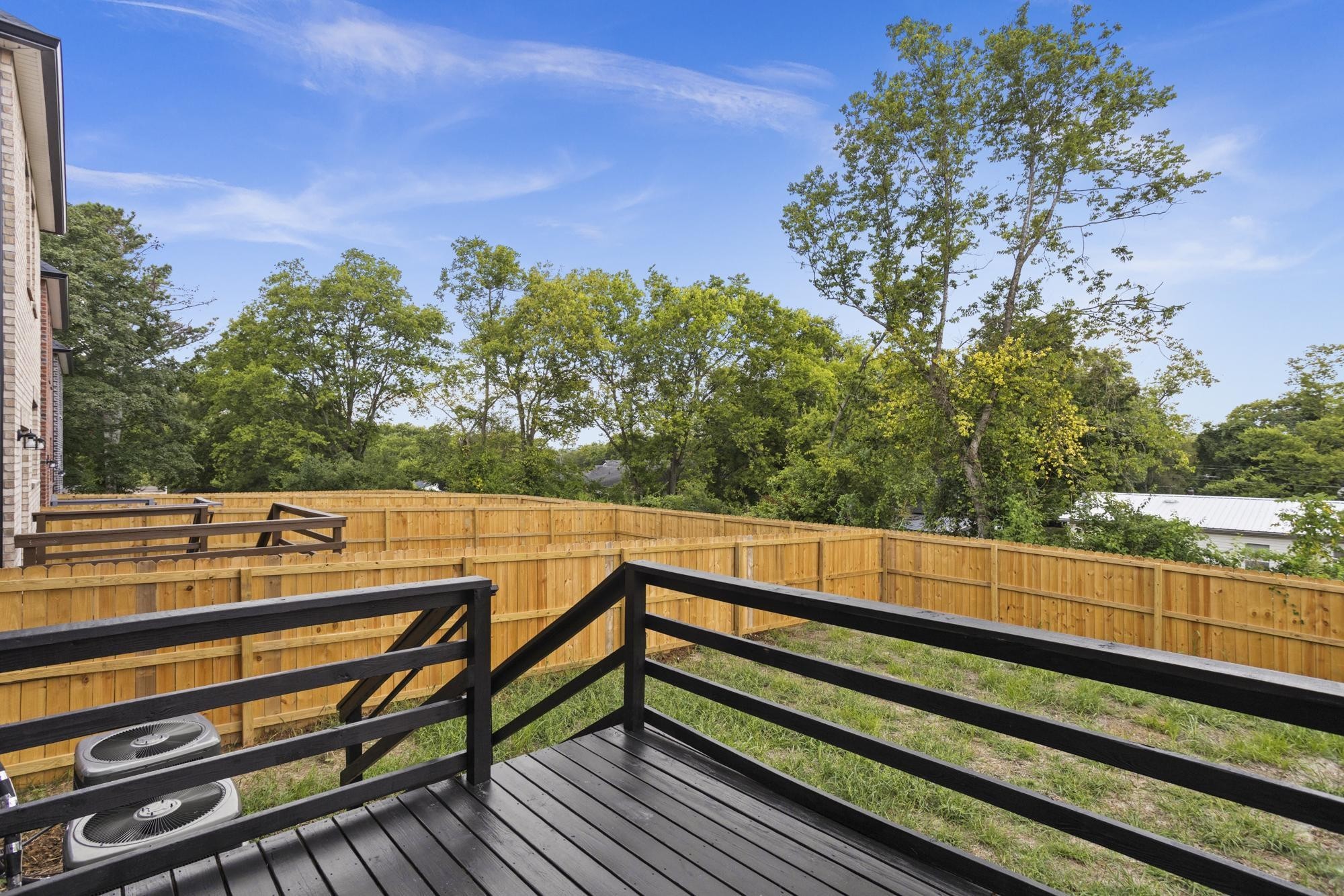 656 Chambers Street, Unit 140 Gallatin, TN 37066 - Photo 26 of 40 a view of a balcony with wooden floor and fence