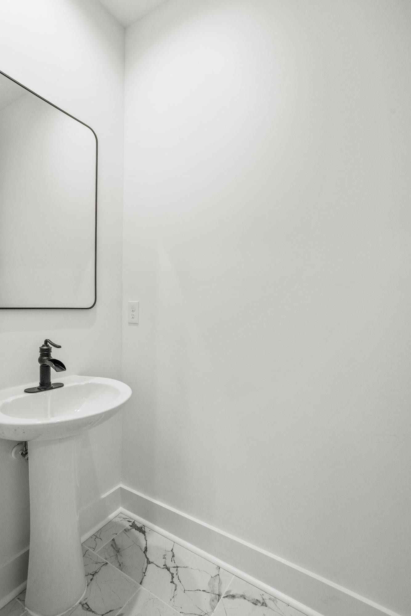 656 Chambers Street, Unit 140 Gallatin, TN 37066 - Photo 29 of 40 a bathroom with a sink and a mirror