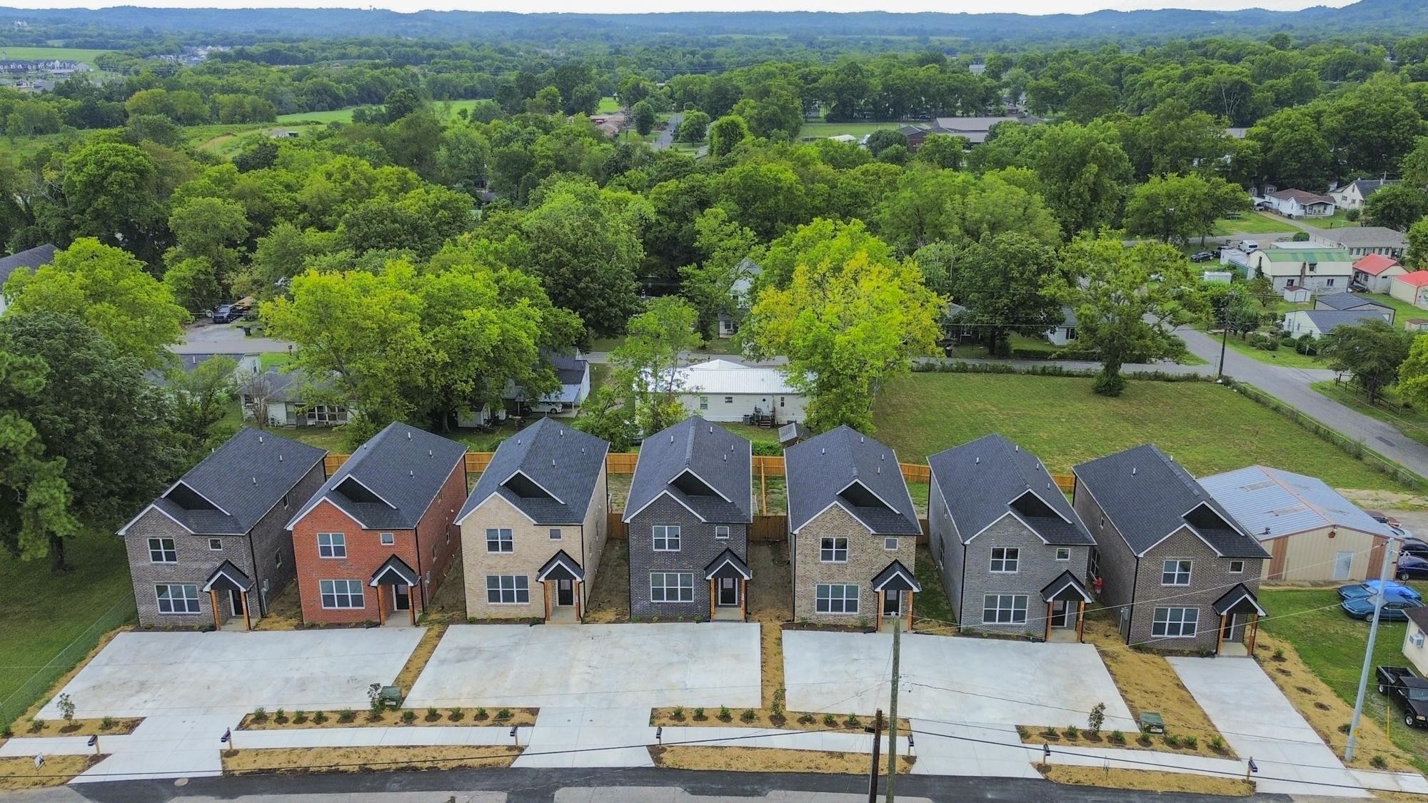 656 Chambers Street, Unit 140 Gallatin, TN 37066 - Photo 3 of 40 an aerial view of residential houses and outdoor space