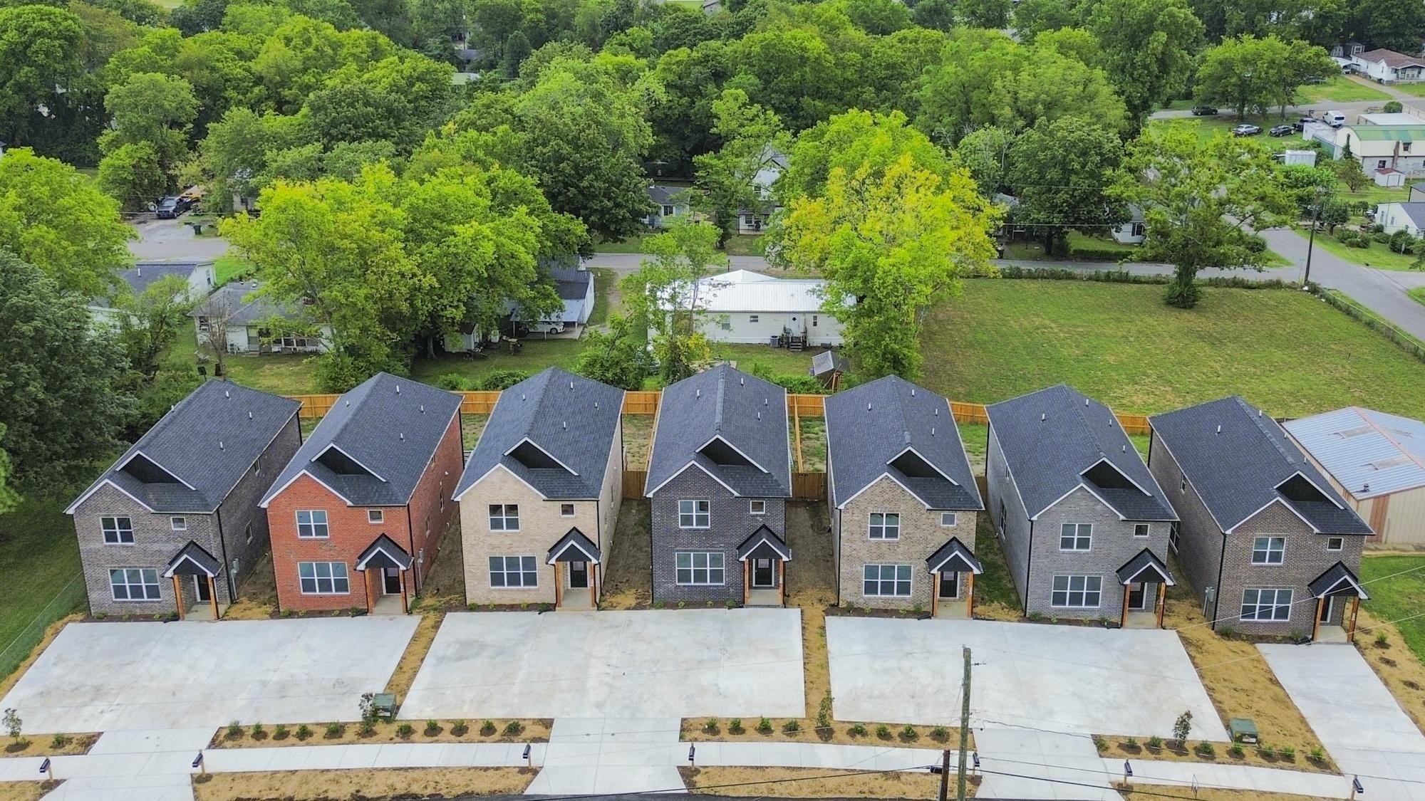 656 Chambers Street, Unit 140 Gallatin, TN 37066 - Photo 37 of 40 an aerial view of a house with garden space and a car park in front of it