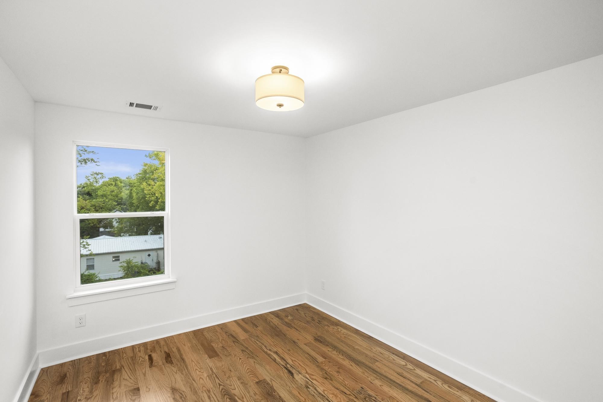 656 Chambers Street, Unit 140 Gallatin, TN 37066 - Photo 8 of 40 a view of a room with wooden floor and a window
