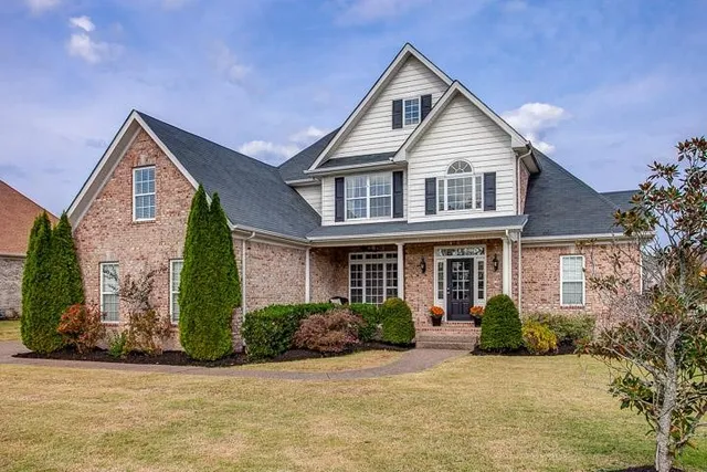 a front view of a house with garden