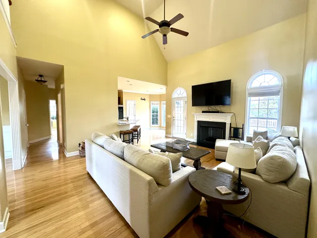 a living room with furniture fireplace and a flat screen tv