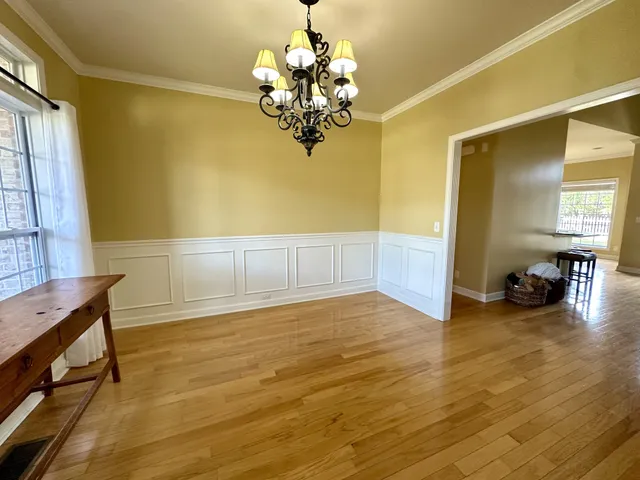 a view of livingroom with hardwood floor and a ceiling fan