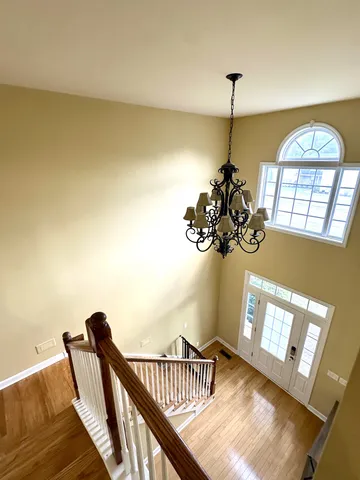 a view of entryway with a chandelier