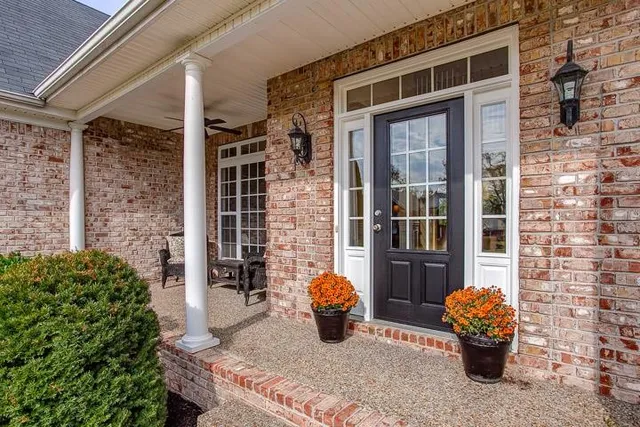 a front view of a house with outdoor seating