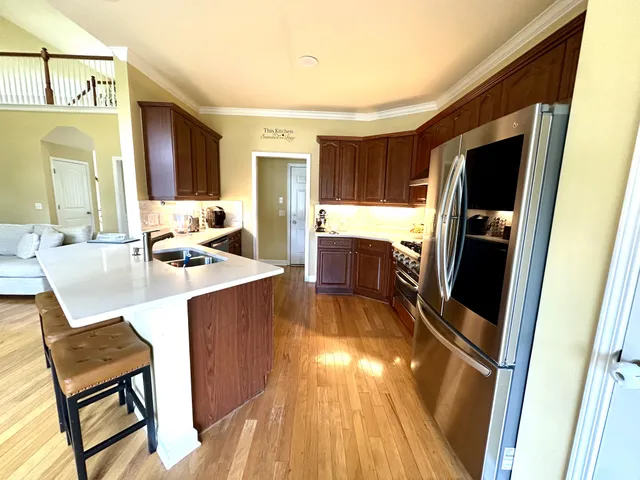 a large bedroom with a large window and a flat screen tv