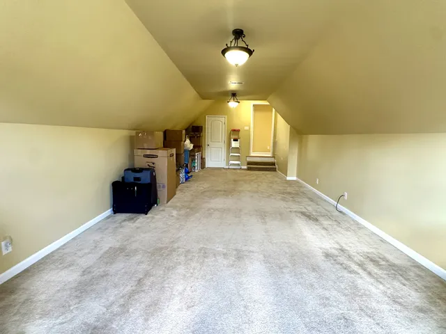 a bed sitting in a room next to a window