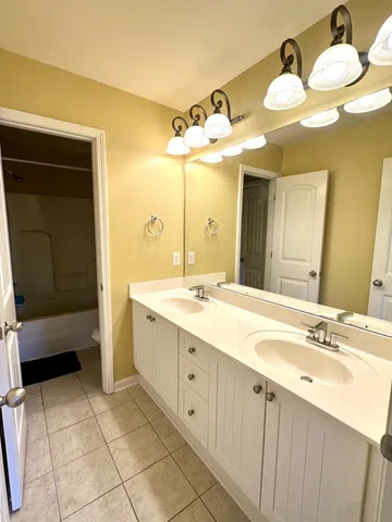 a view of a livingroom with workspace and a window