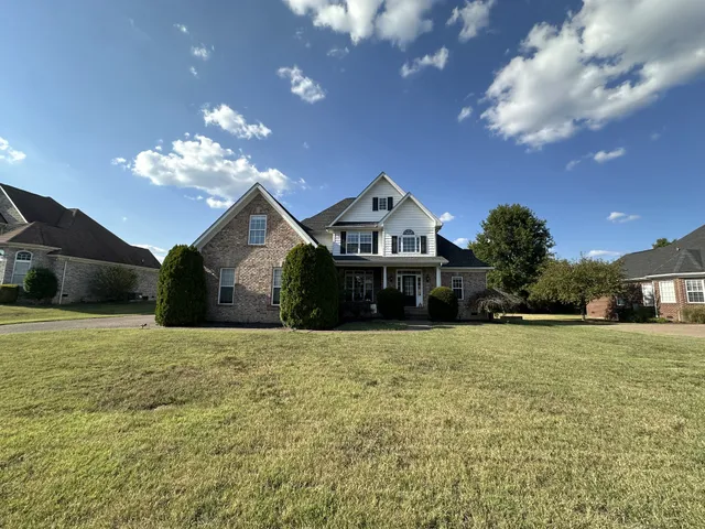 a front view of a house with a yard