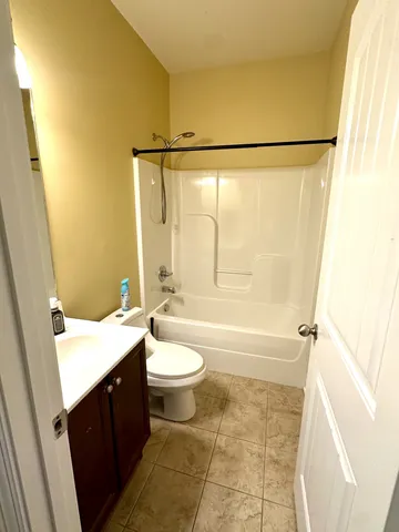 a view of a hallway view with wooden floor and living room