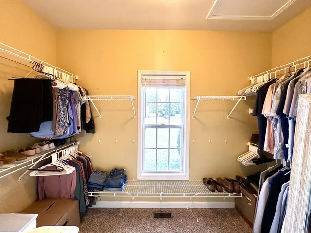 a spacious bathroom with a double vanity sink and a mirror