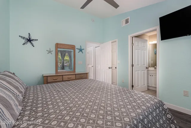 a bathroom with a toilet a sink and a mirror